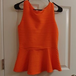 Bisou Bisou orange shirt.